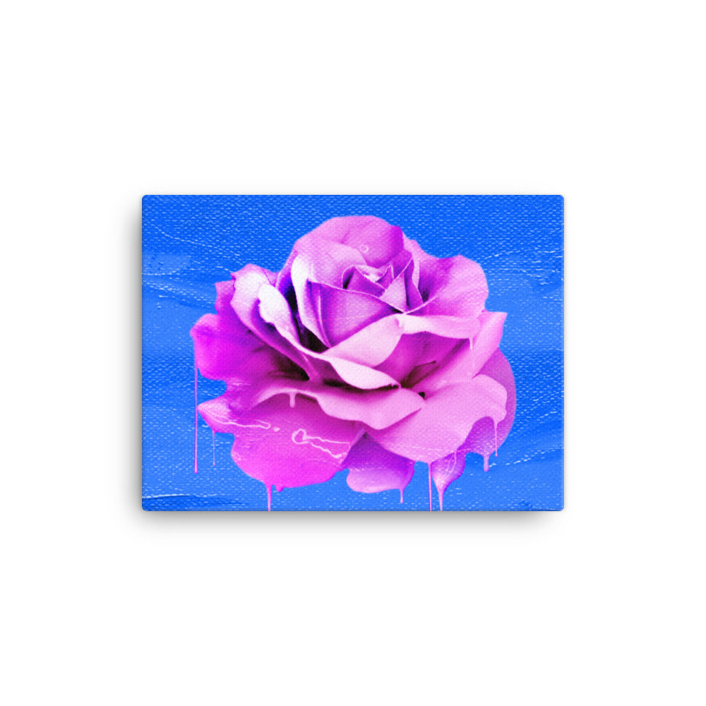 Beautifully Crushed Petals is a canvas wall art with a beautiful pink melting rose covering the majority of the image against a sky blue canvas textured background.