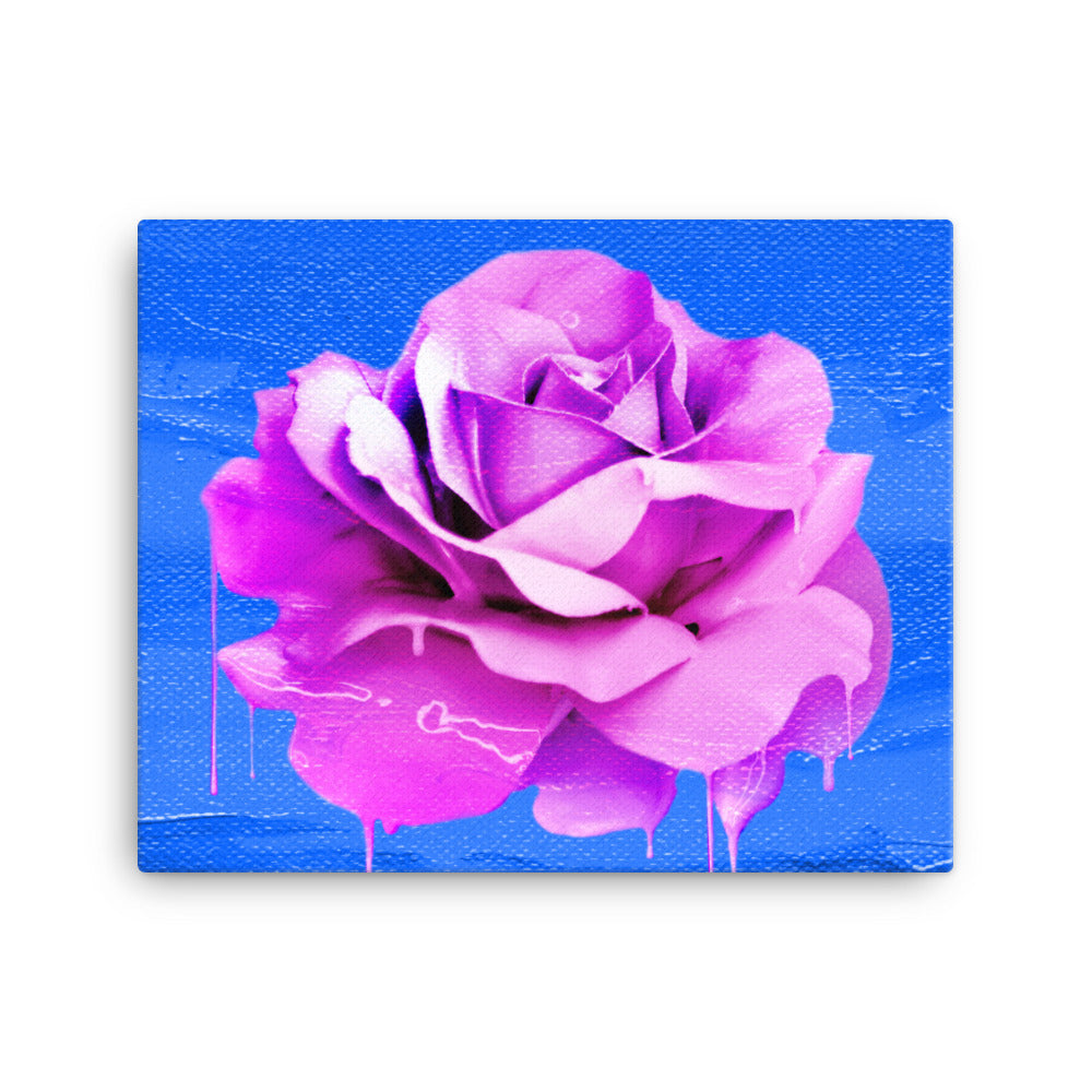 Beautifully Crushed Petals is a canvas wall art with a beautiful pink melting rose covering the majority of the image against a sky blue canvas textured background.